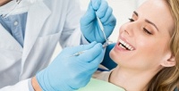 <b>Скидка до 60%.</b> Гигиена полости рта или лечение кариеса в стоматологической клинике DenTra Clinic